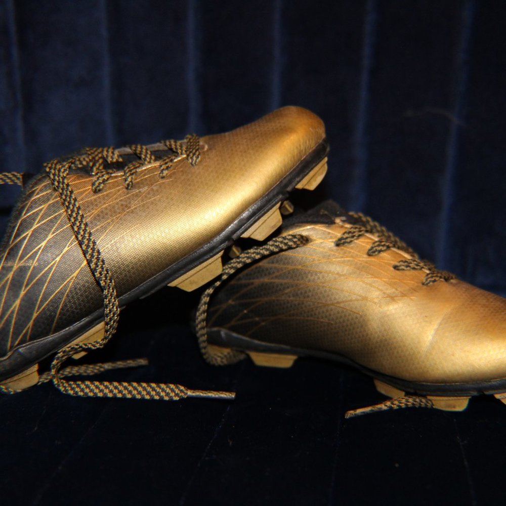 Like New Gold and Black Child Cleats size 10k